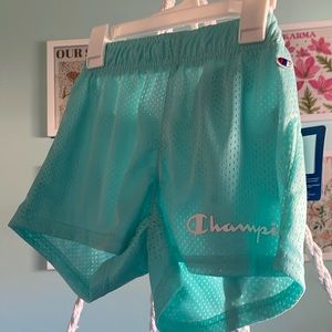 Teal champion basketball shorts for girls.